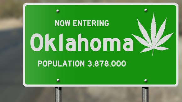 Oklahoma road sign with marijuana leaf.