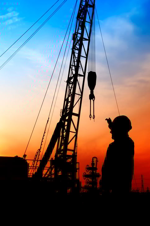 An oil rig at sunset.