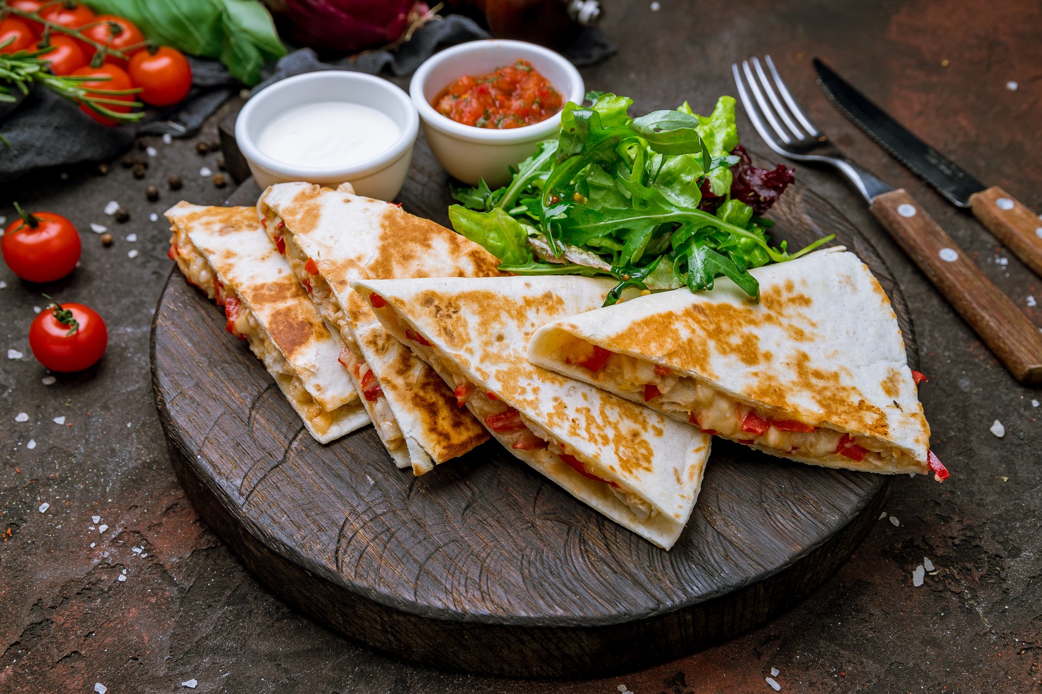 Quesadilla served on a wooden platter