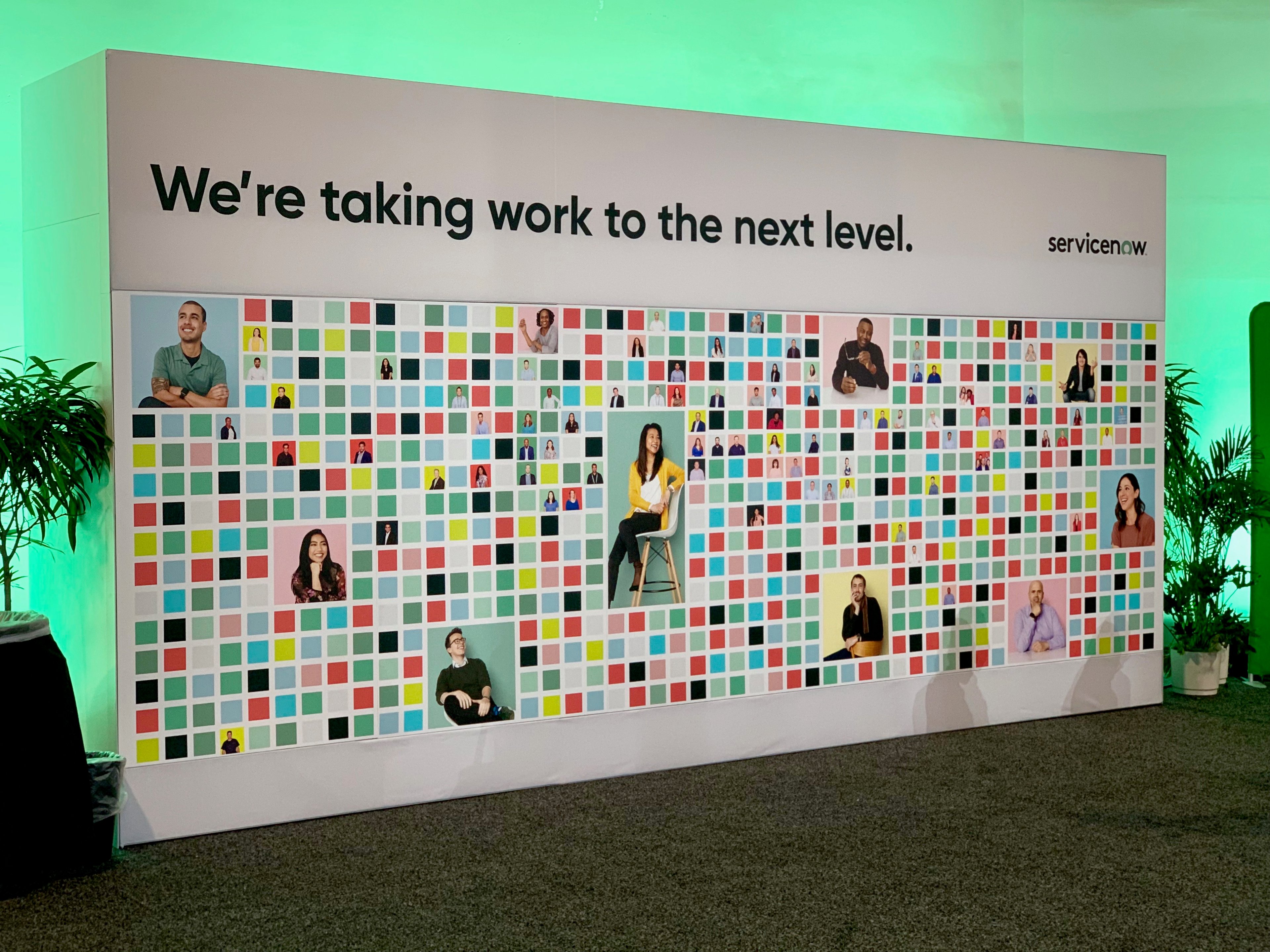 A mural featuring different employees at the ServiceNow headquarters