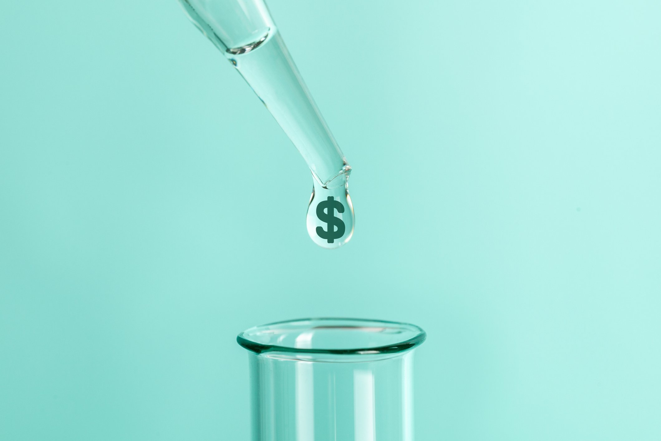 A dropper hovers over a test tube, with a dollar sign coming out of the dropper.