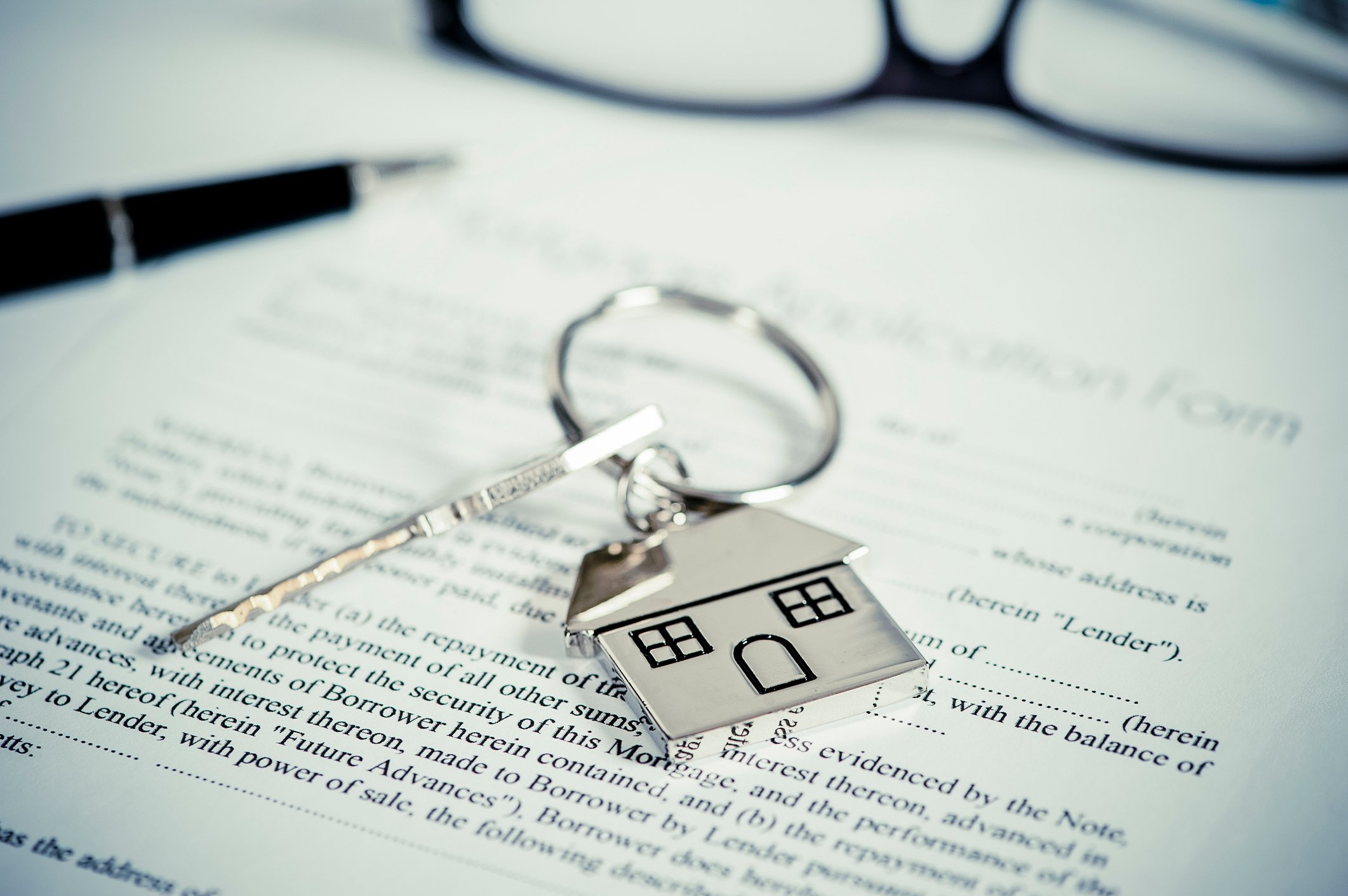 Mortgage document with key.