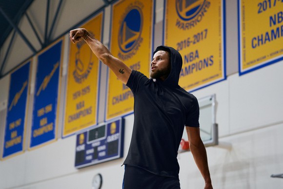 A basketball player wears Under Armour gear.