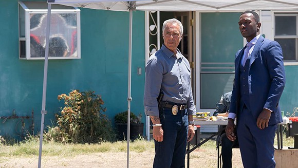 Two detectives staring off screen on the set of "Bosch"