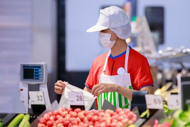Supermarket worker masked