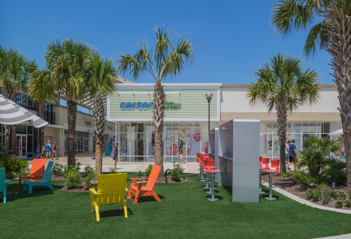 Outdoor area of a Tanger outlet mall.