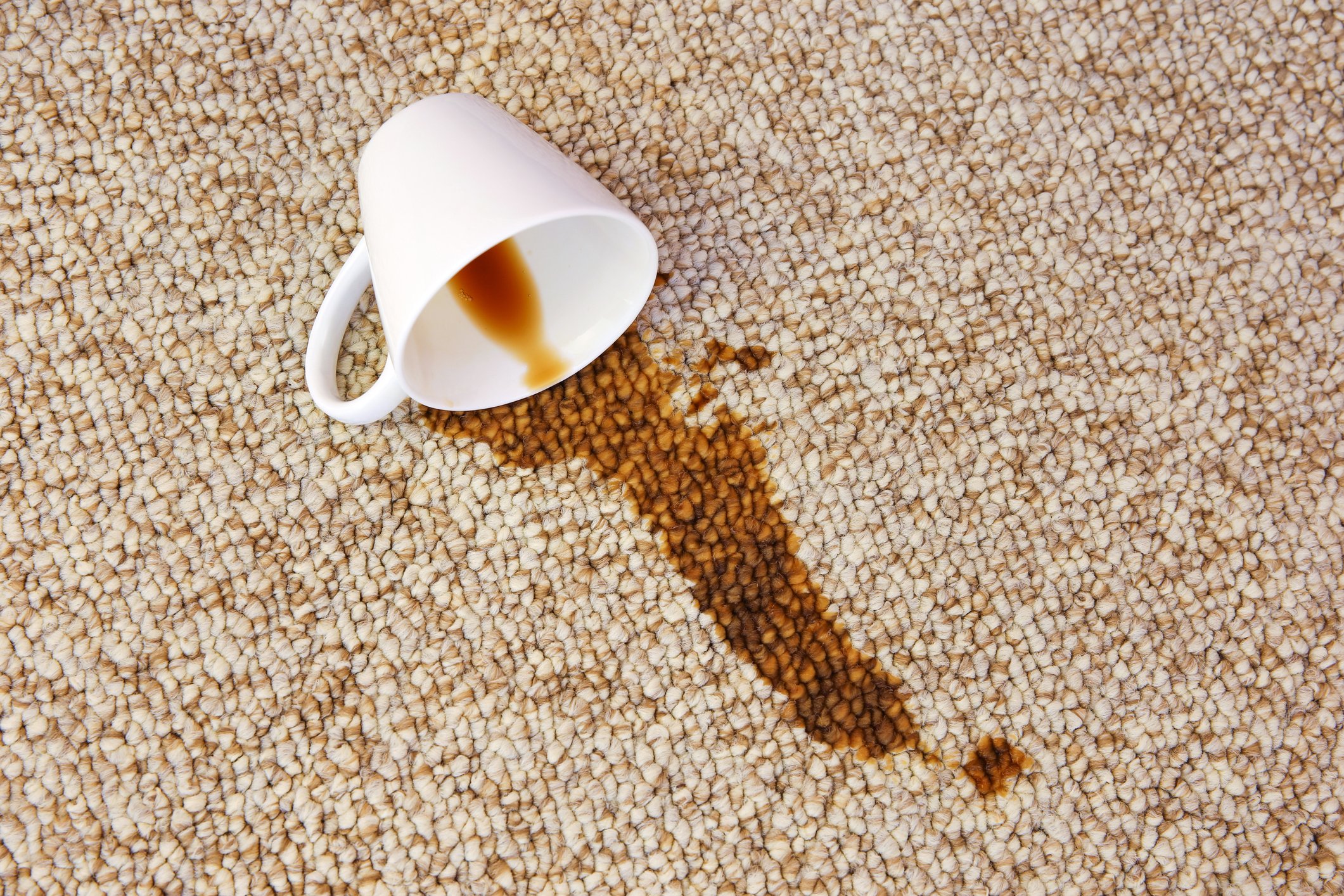 Spilled coffee on a rug.
