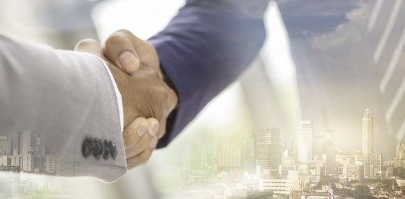 Two men shaking hands on a deal.