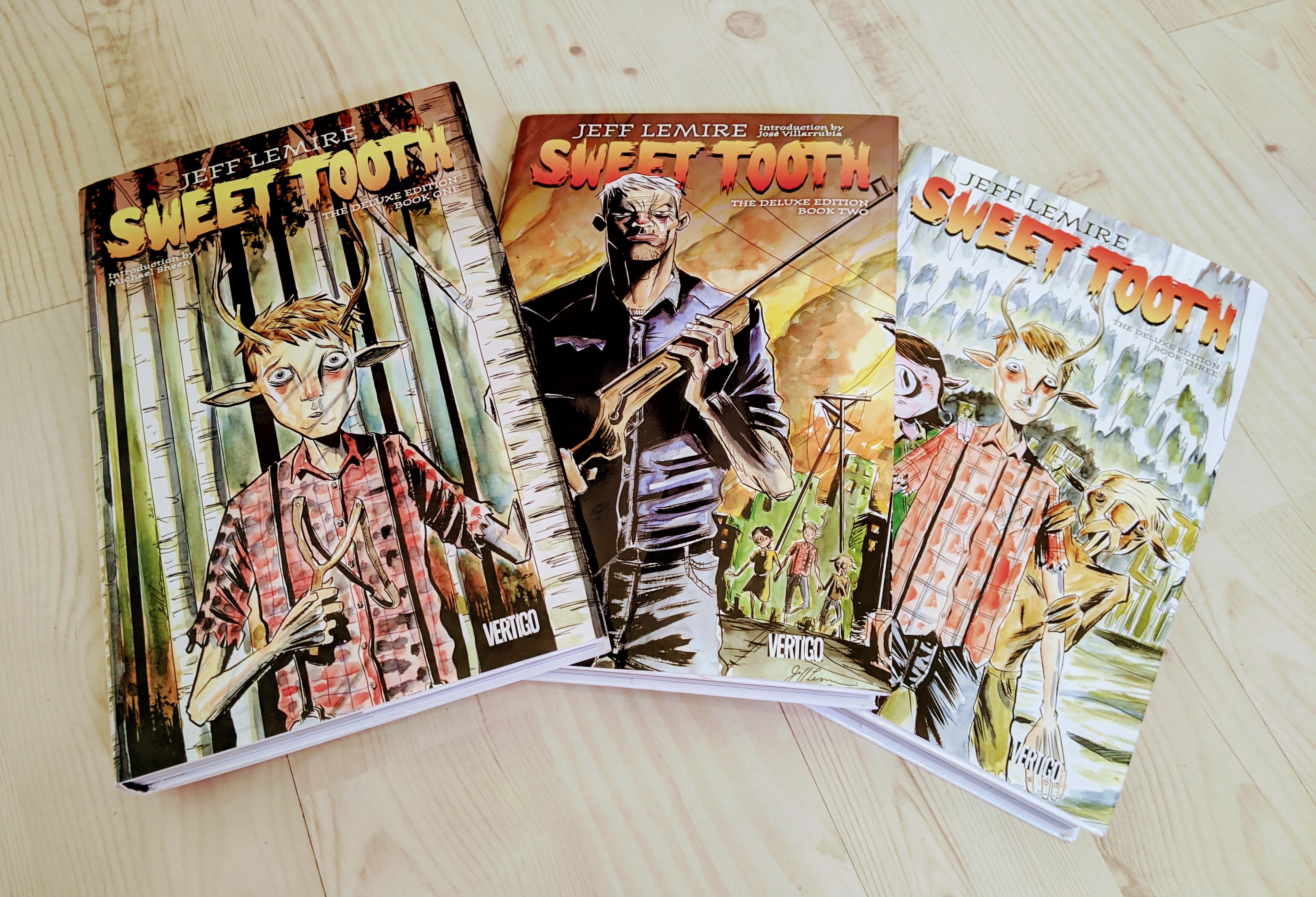 A photo of the three hardback "Sweet Tooth" books.