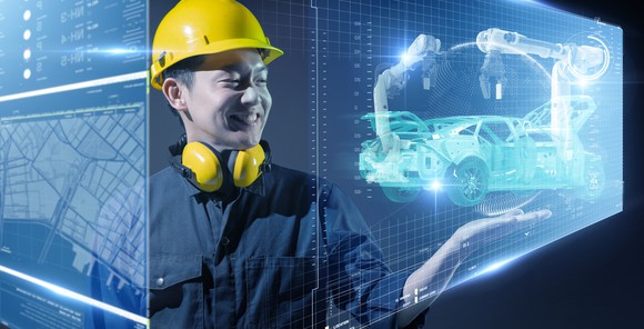 Factory engineer using virtual tools to plan manufacturing flow.