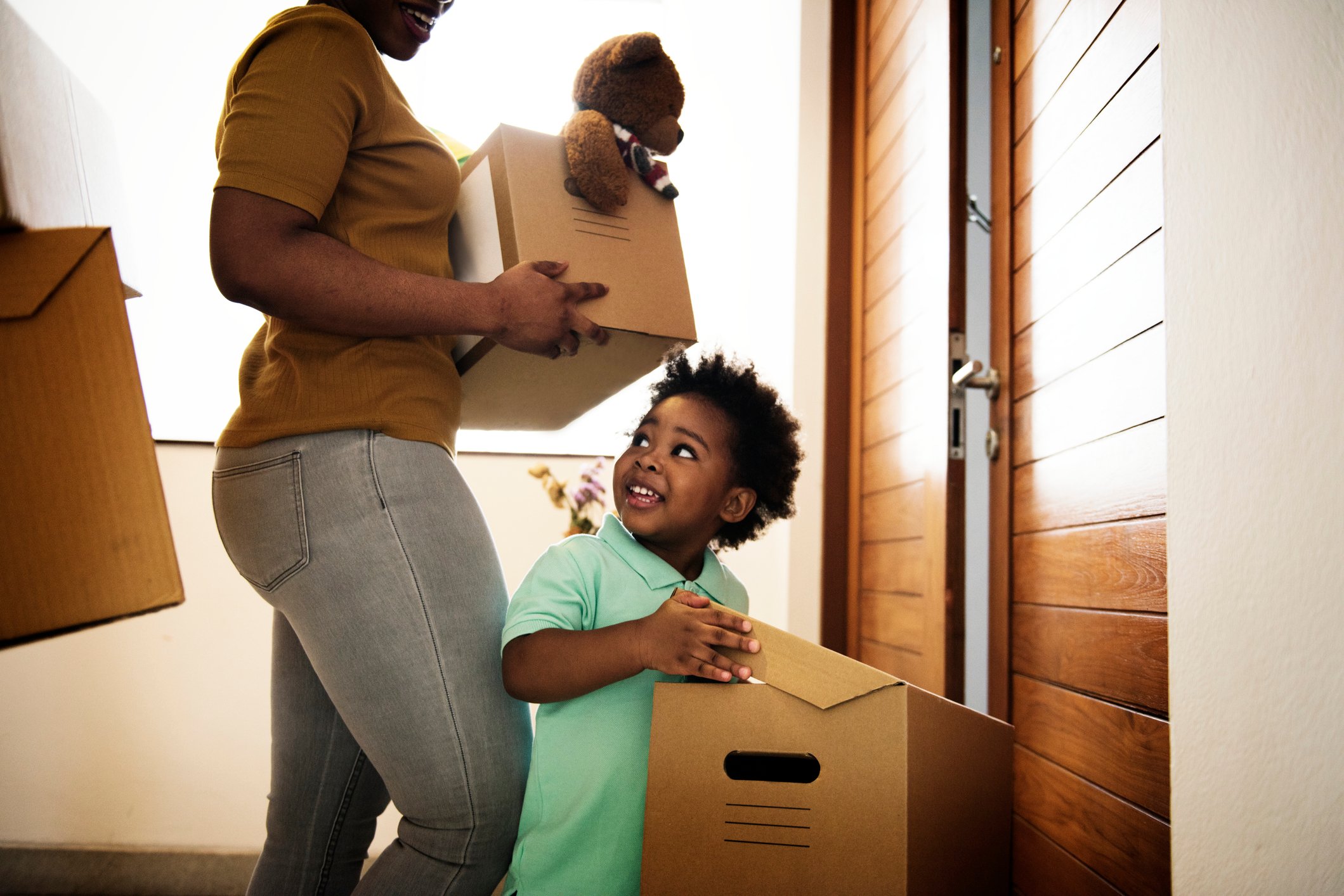 Cute kid helping his family move in.