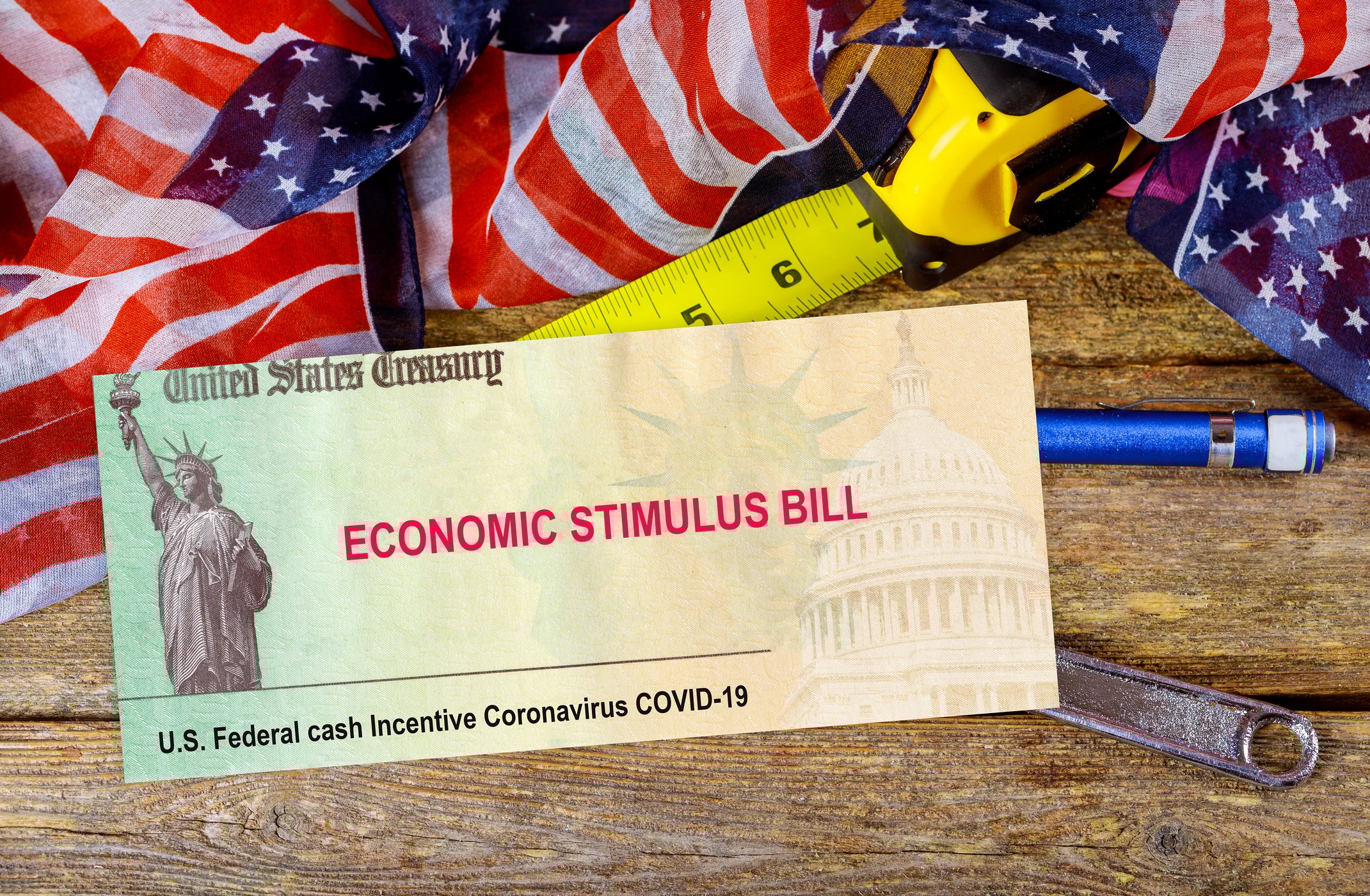Paper the size of a check with U.S. Treasury economic stimulus bill printed on it