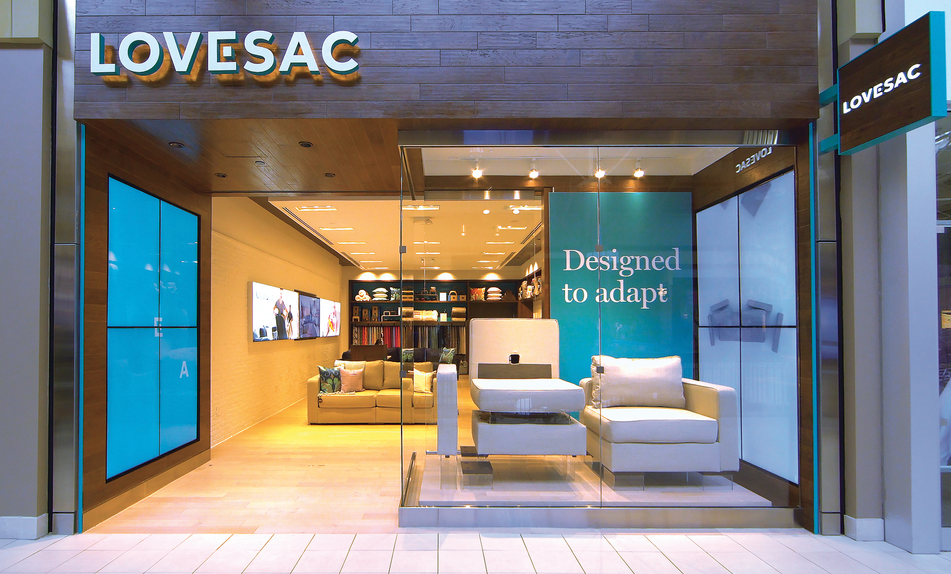 Exterior shot of a Lovesac showroom with Sactional pieces on display.