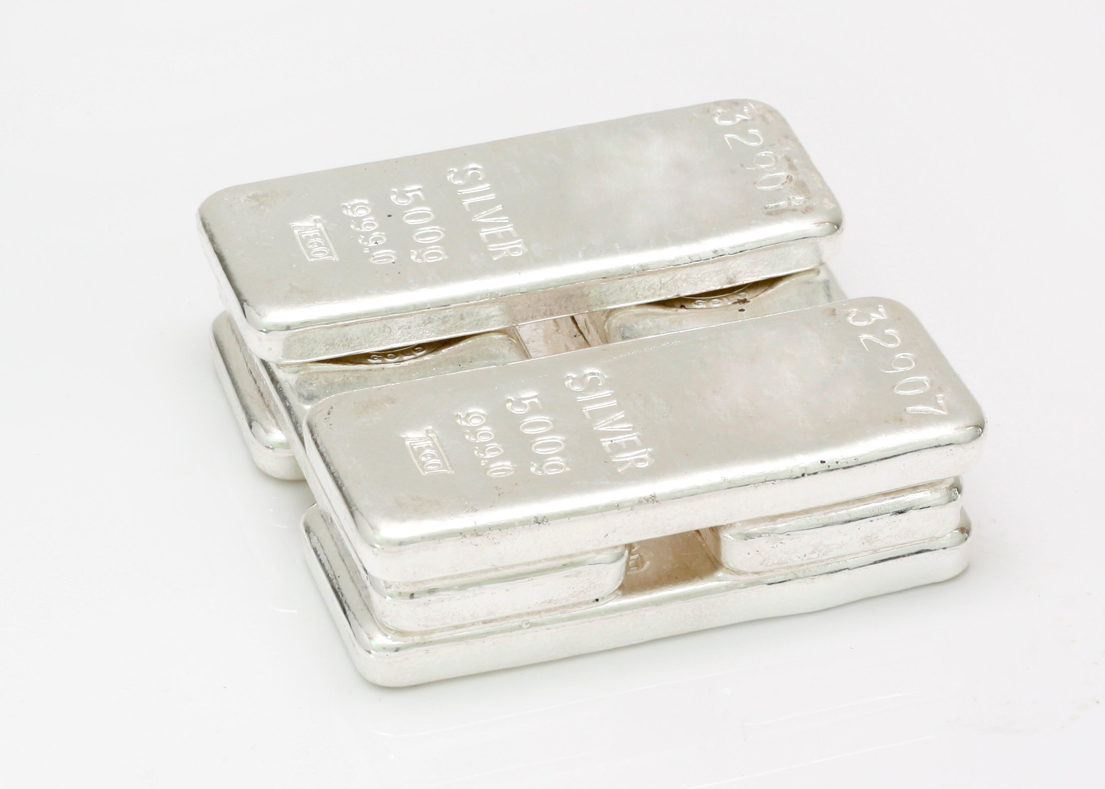 Several silver bars stacked on top of each other.