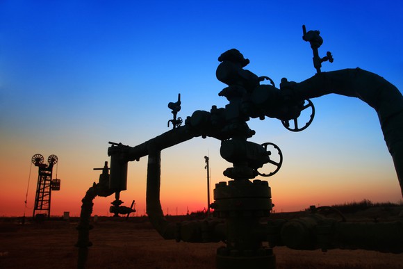 An oilfield pipeline at sunset