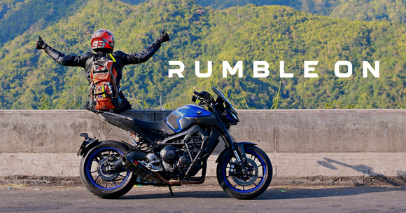 Motorcycle rider next to "RumbleON" text, with a motorcycle in the foreground