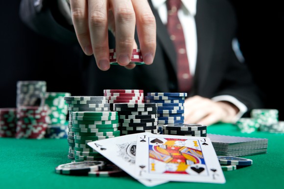 A gambling table with cards and chips.