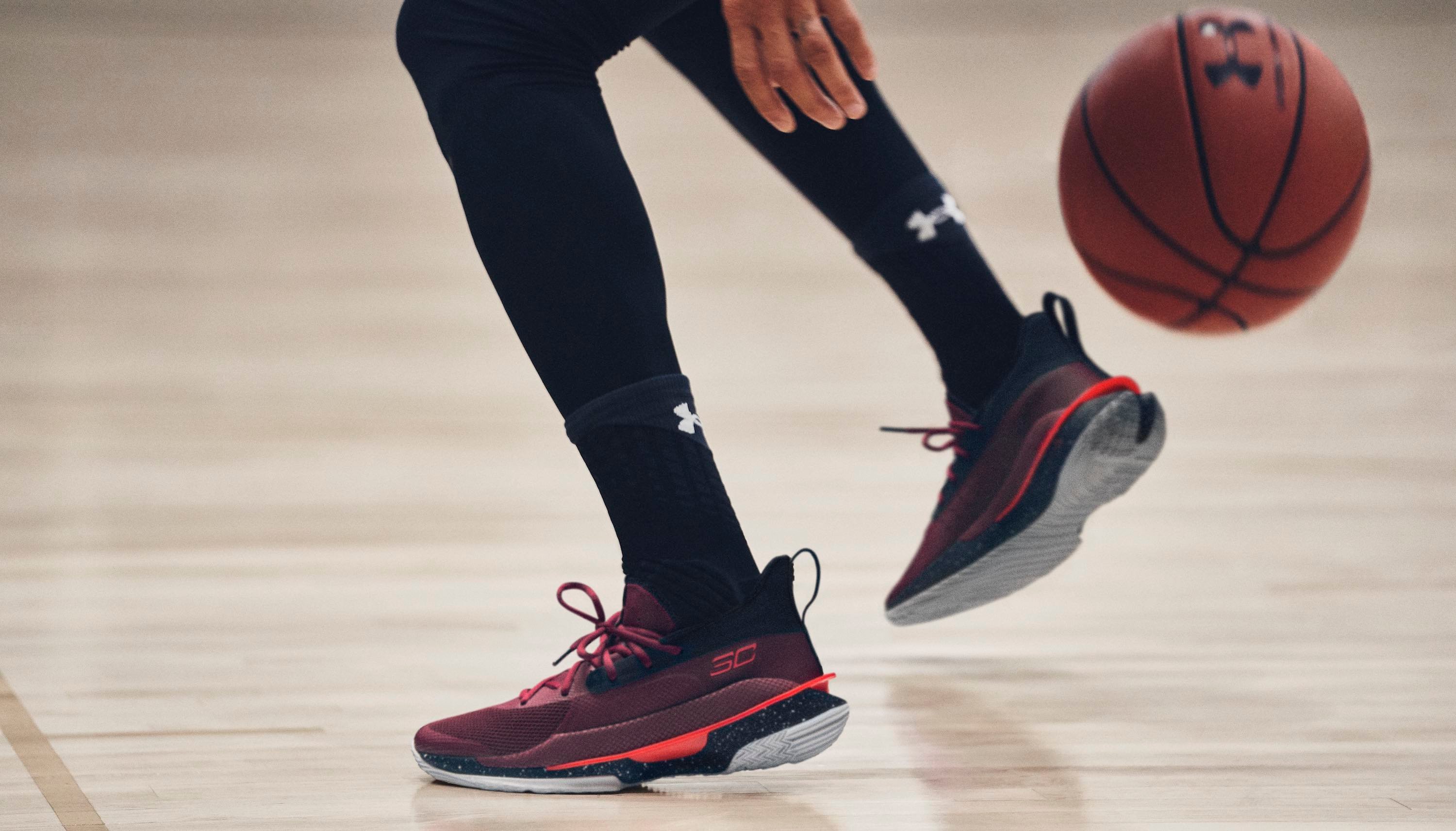 Athlete playing basketball wearing Under Armour clothes