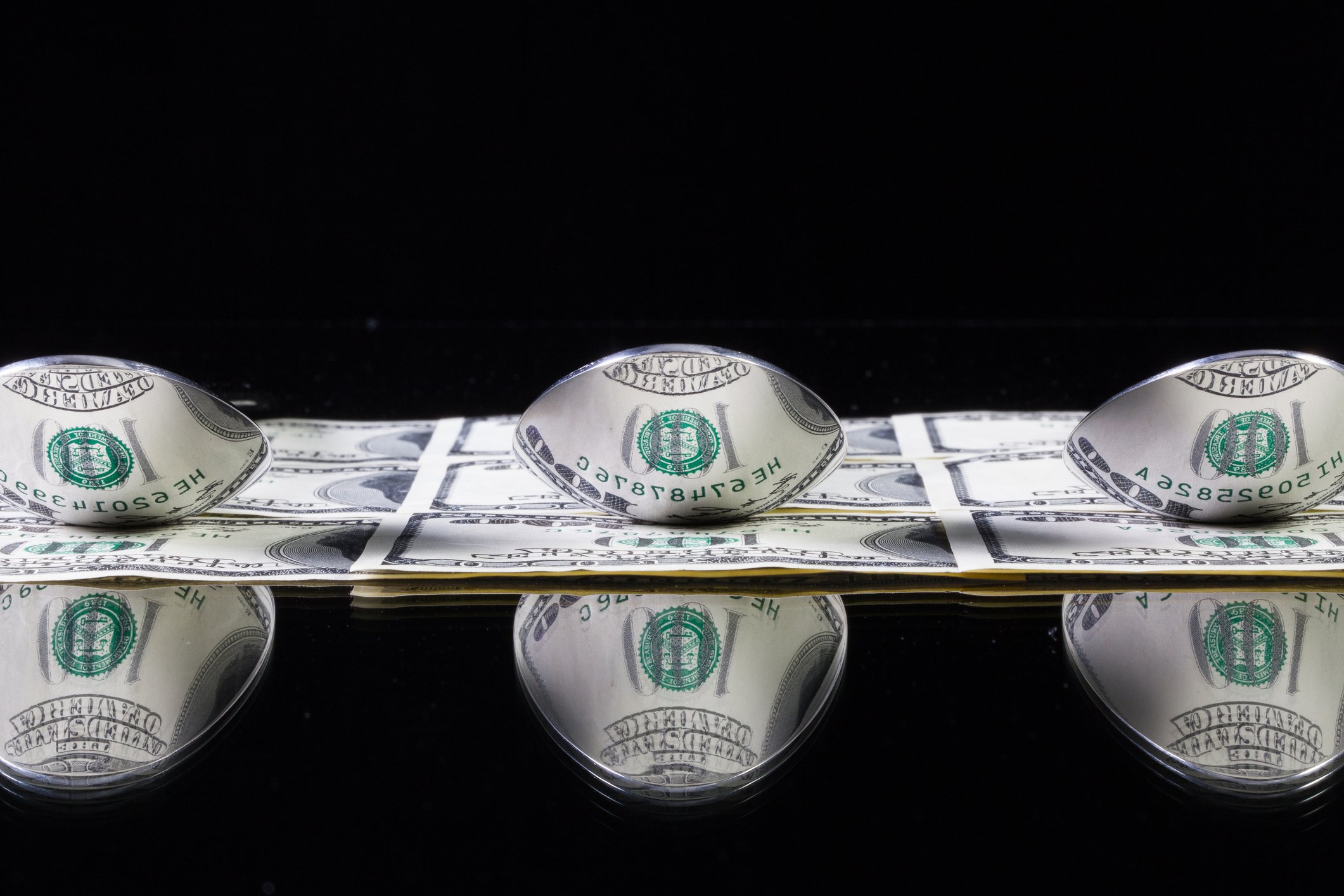 Money with stainless steel spoons