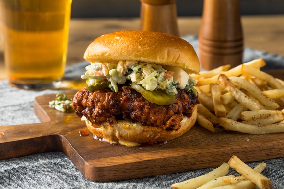 Chicken sandwich with fries.