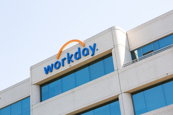 Side of office building with Workday logo on the top floor.