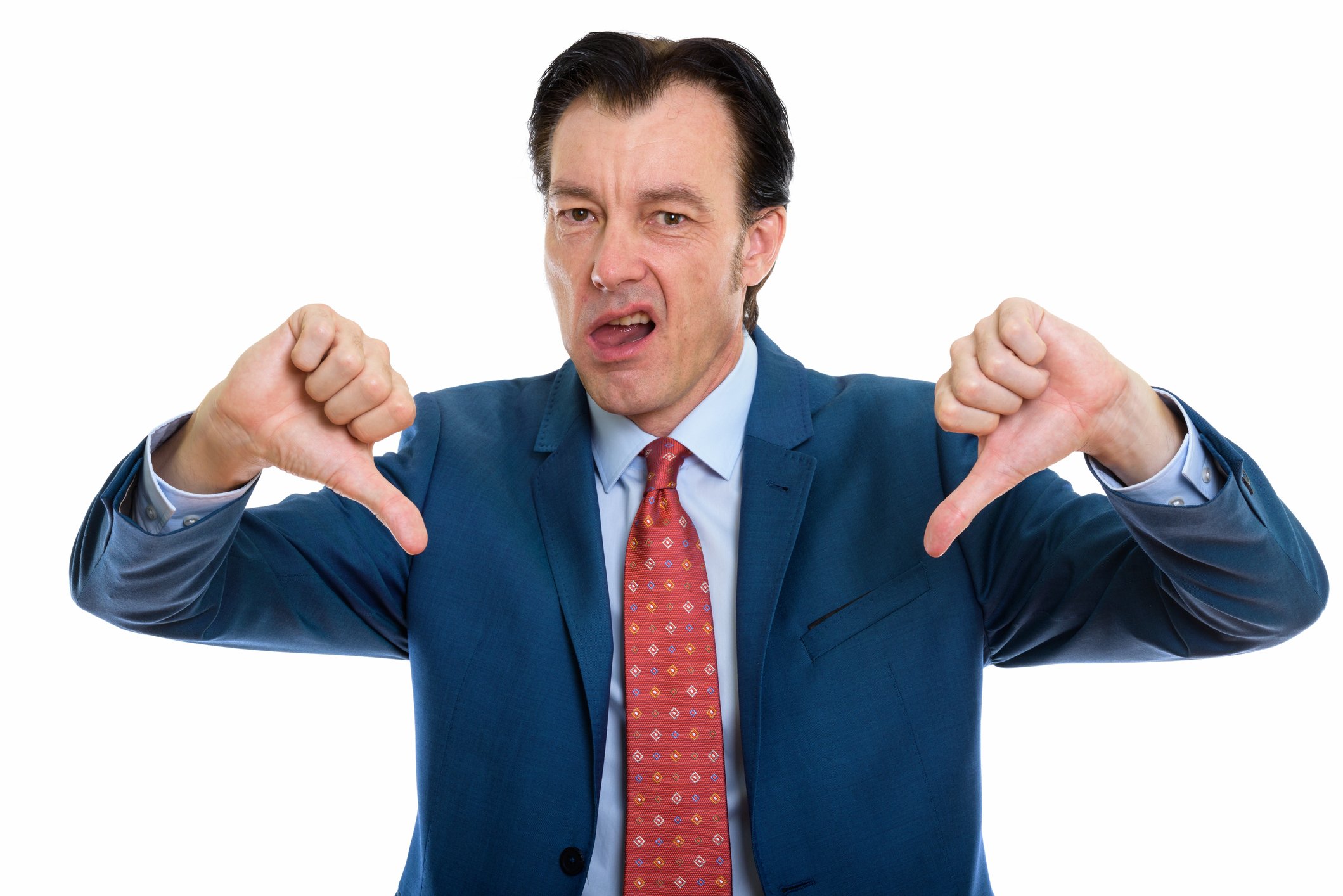 Man in suit giving two thumbs down sign.