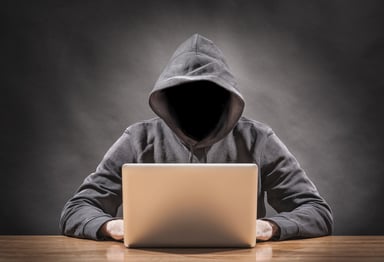 hacker in hoodie identity theft cyber security