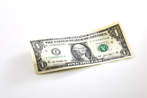 A dollar bill on a white background.