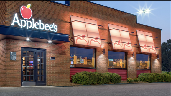 an exterior view of an Applebee's restaurant at dusk.