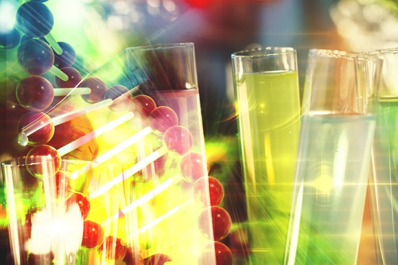 Concept art of a strand of DNA and test tubes.