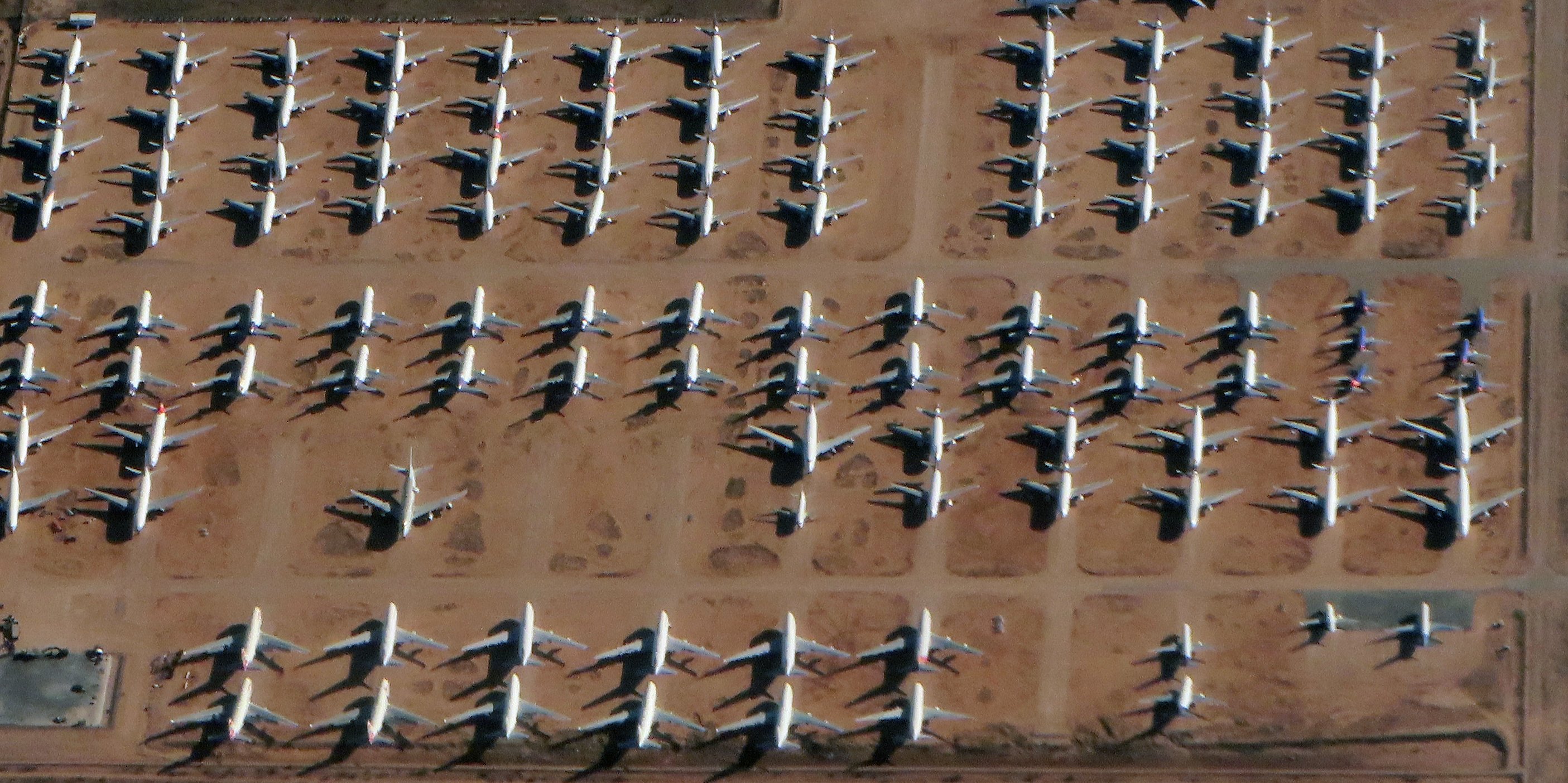 overhead view of fleet of airplanes parked