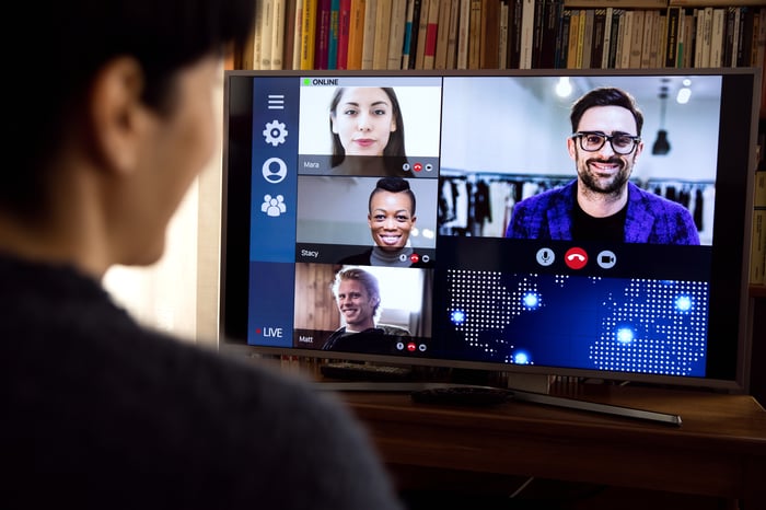 A person having a Zoom call from a home office. 