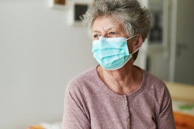 Older woman wearing mask_GettyImages-1213437805