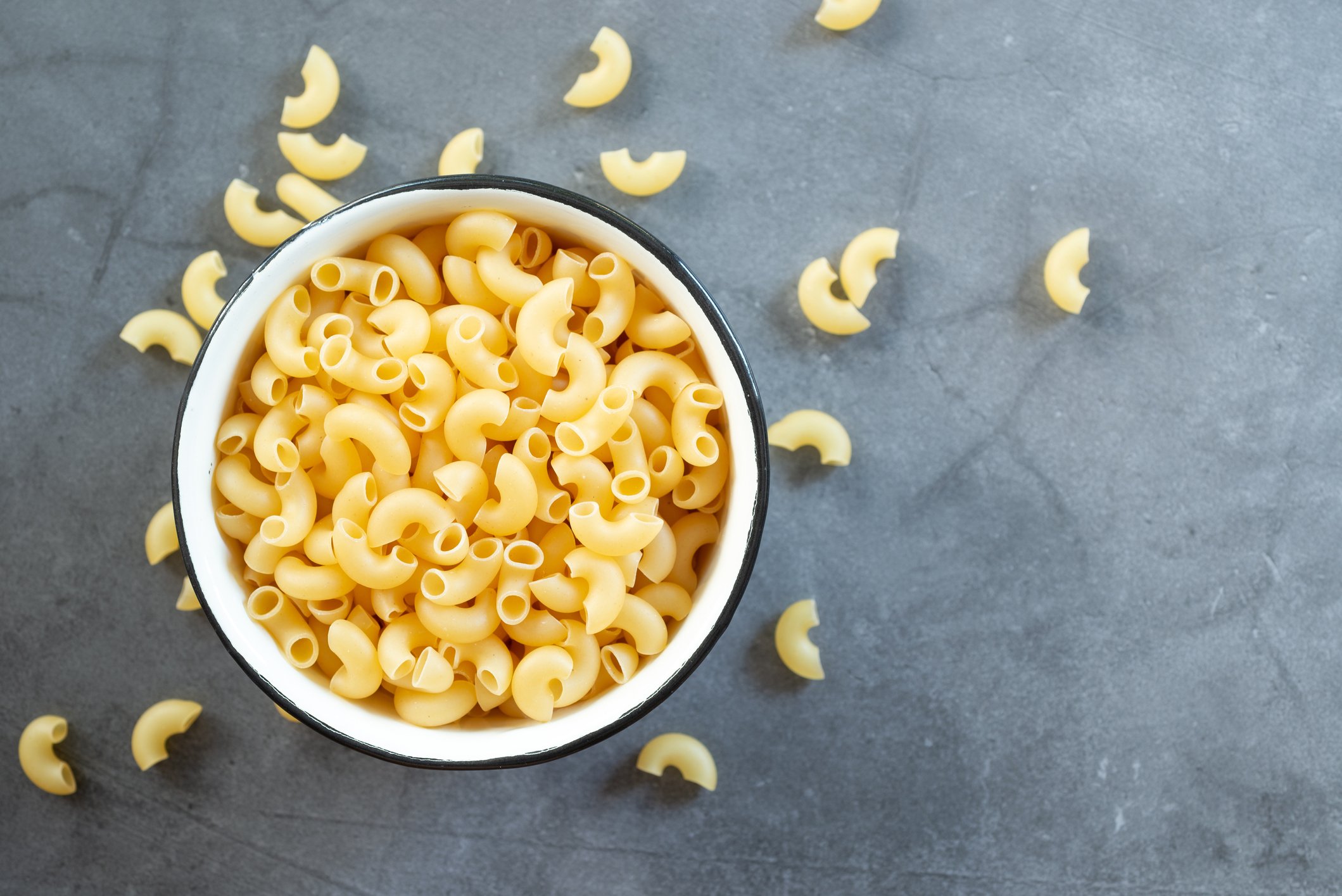 A bowl of uncooked macaroni.