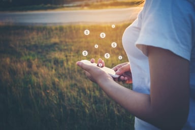 young-person-mobile-investing-outside