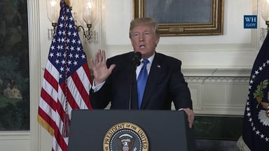 Trump holding up hand