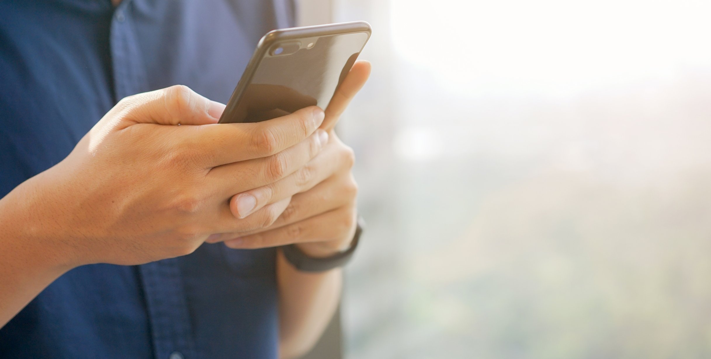 A person using a mobile phone.