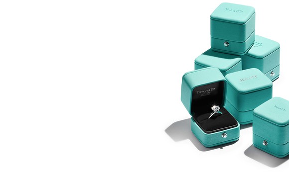 Tiffany blue jewelry boxes and a diamond ring.