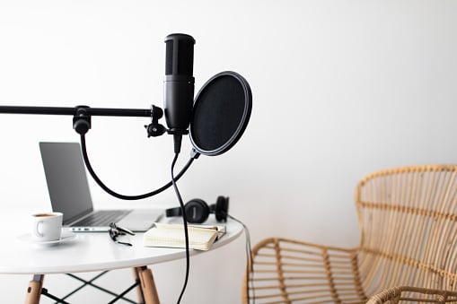 A microphone, a table and a chair