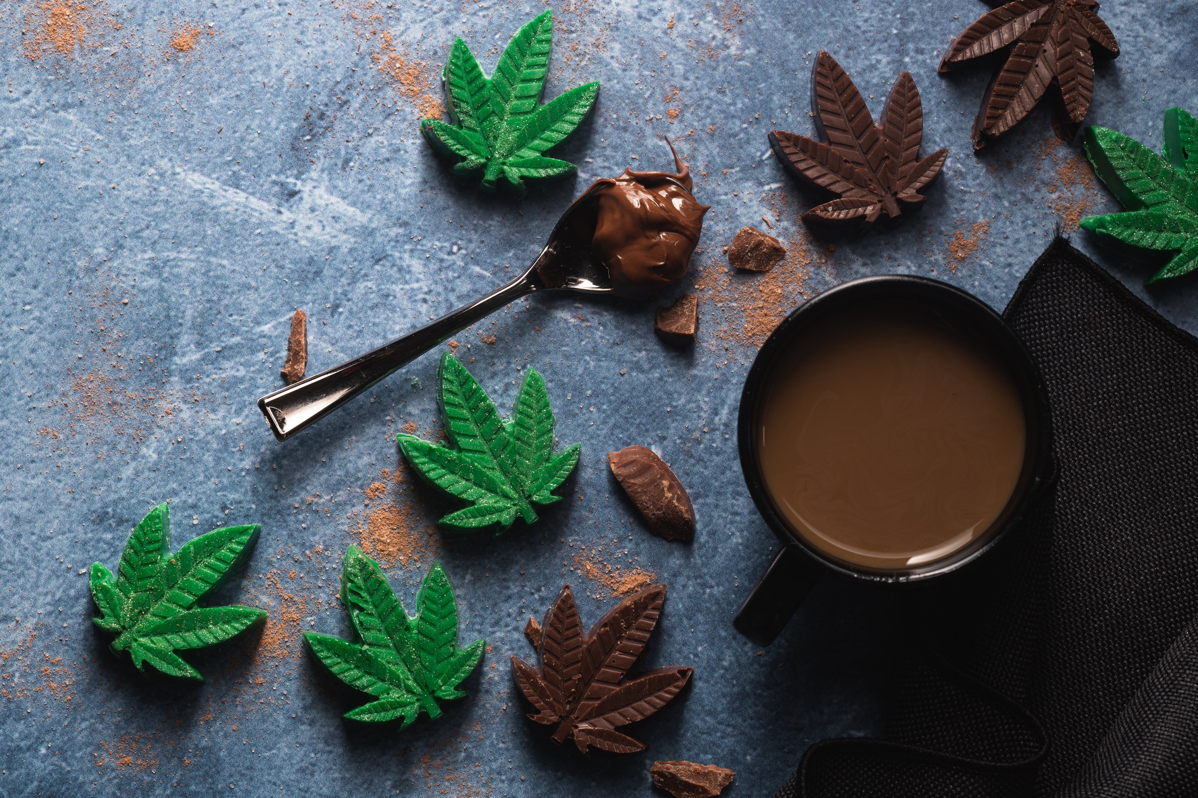cannabis infused edible chocolate leaves with beverage
