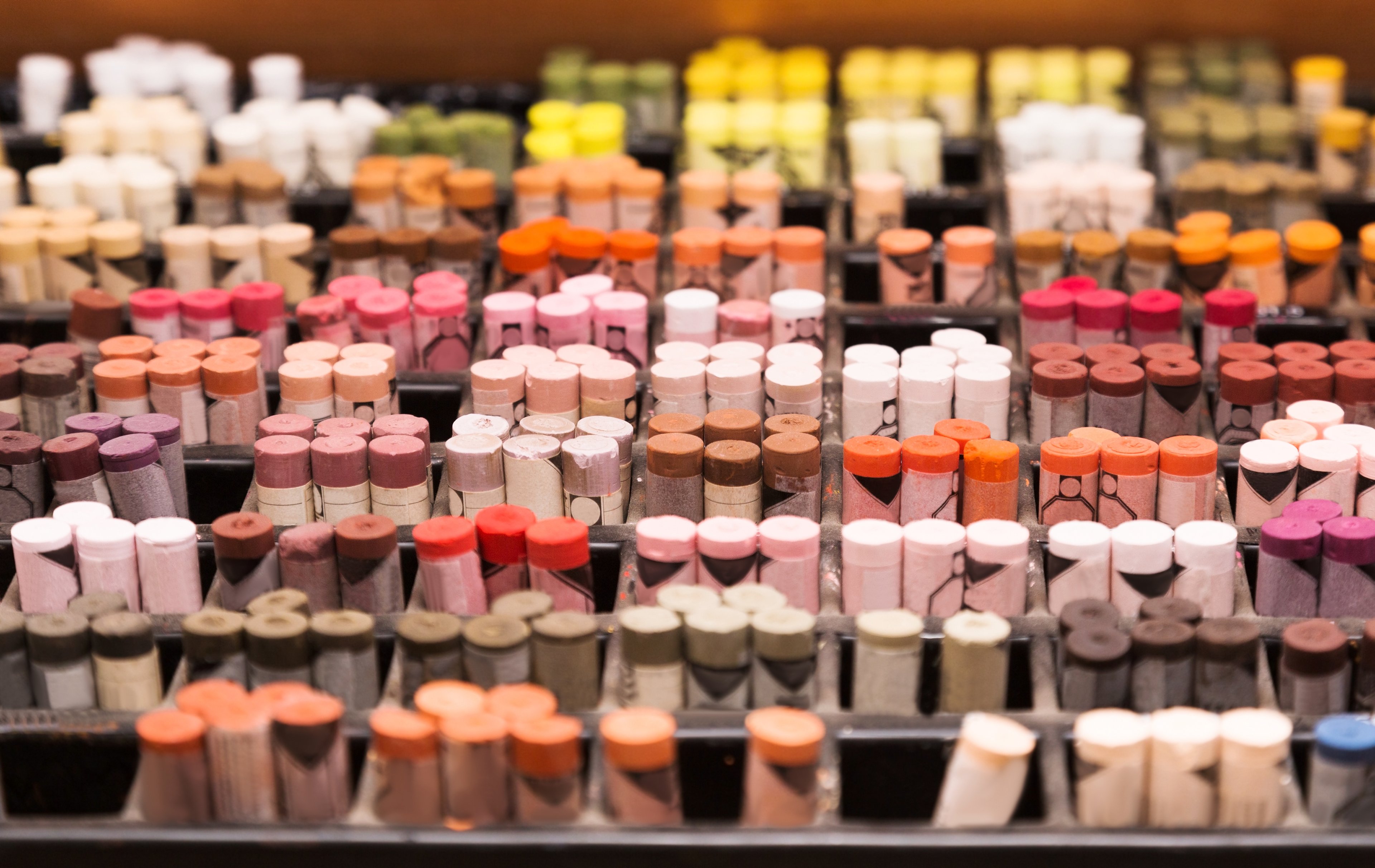 An array of colorful chalks in a craft store.