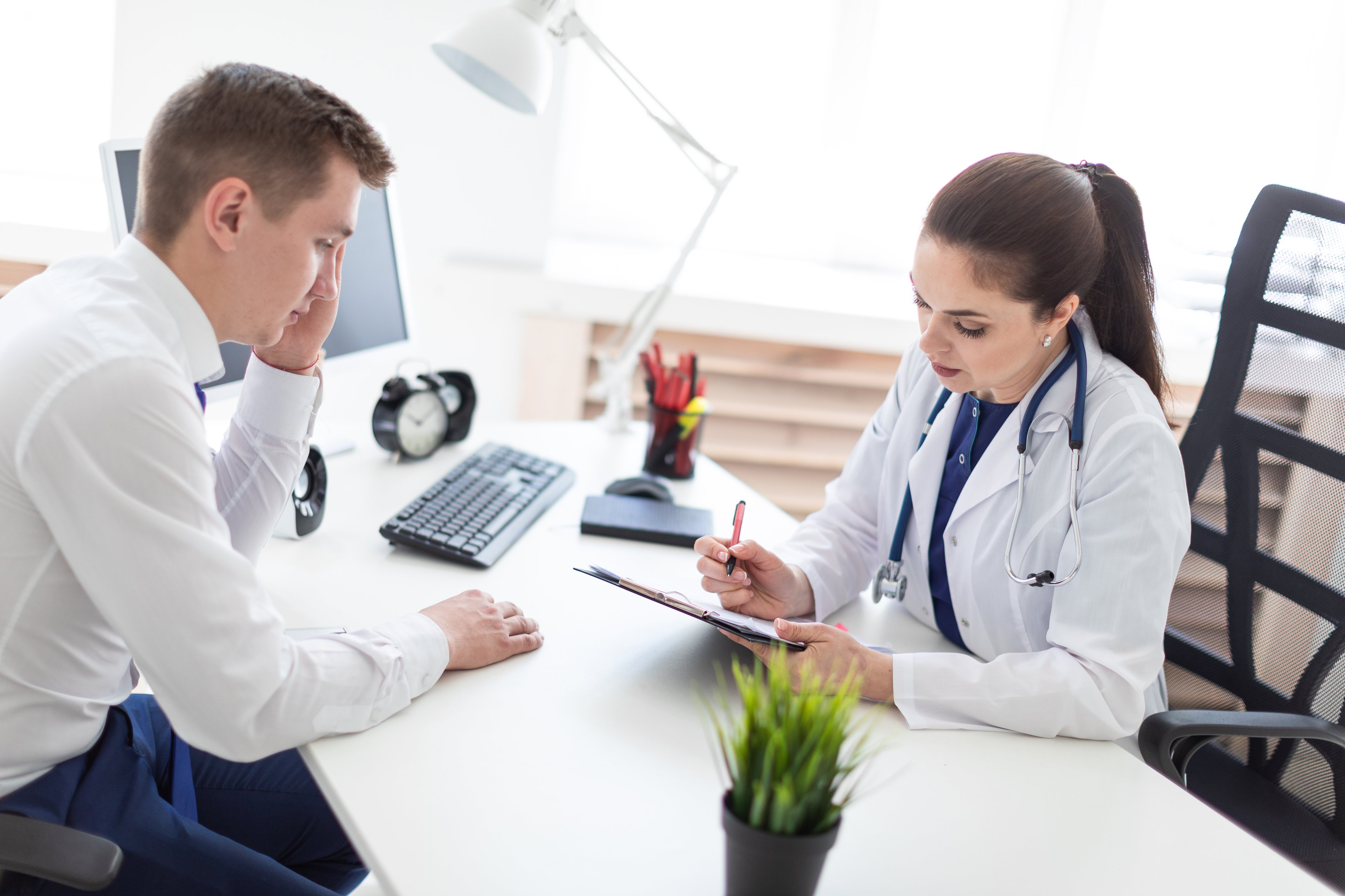 Young man visiting doctor. 