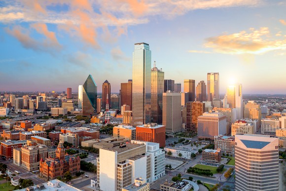 A view of a large city with clouds overhead.
