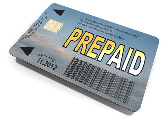 Closeup of a debt card with the word Prepaid stampedon it. 