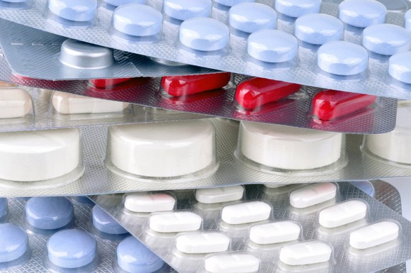 A stack of various pill sleeves.