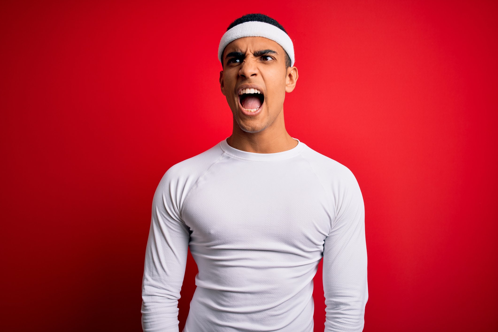 A man in a headband and shirt.