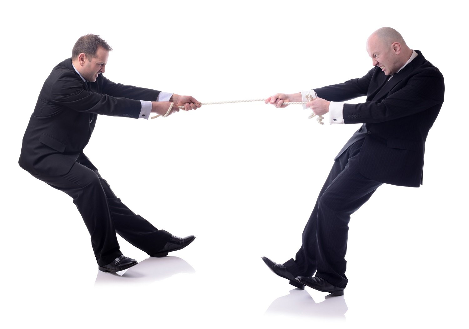 Two men playing tug of war.