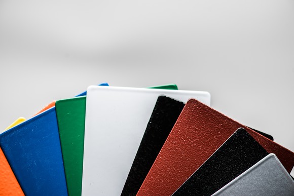 Metal rectangles of different colors fanned out like a hand of cards 