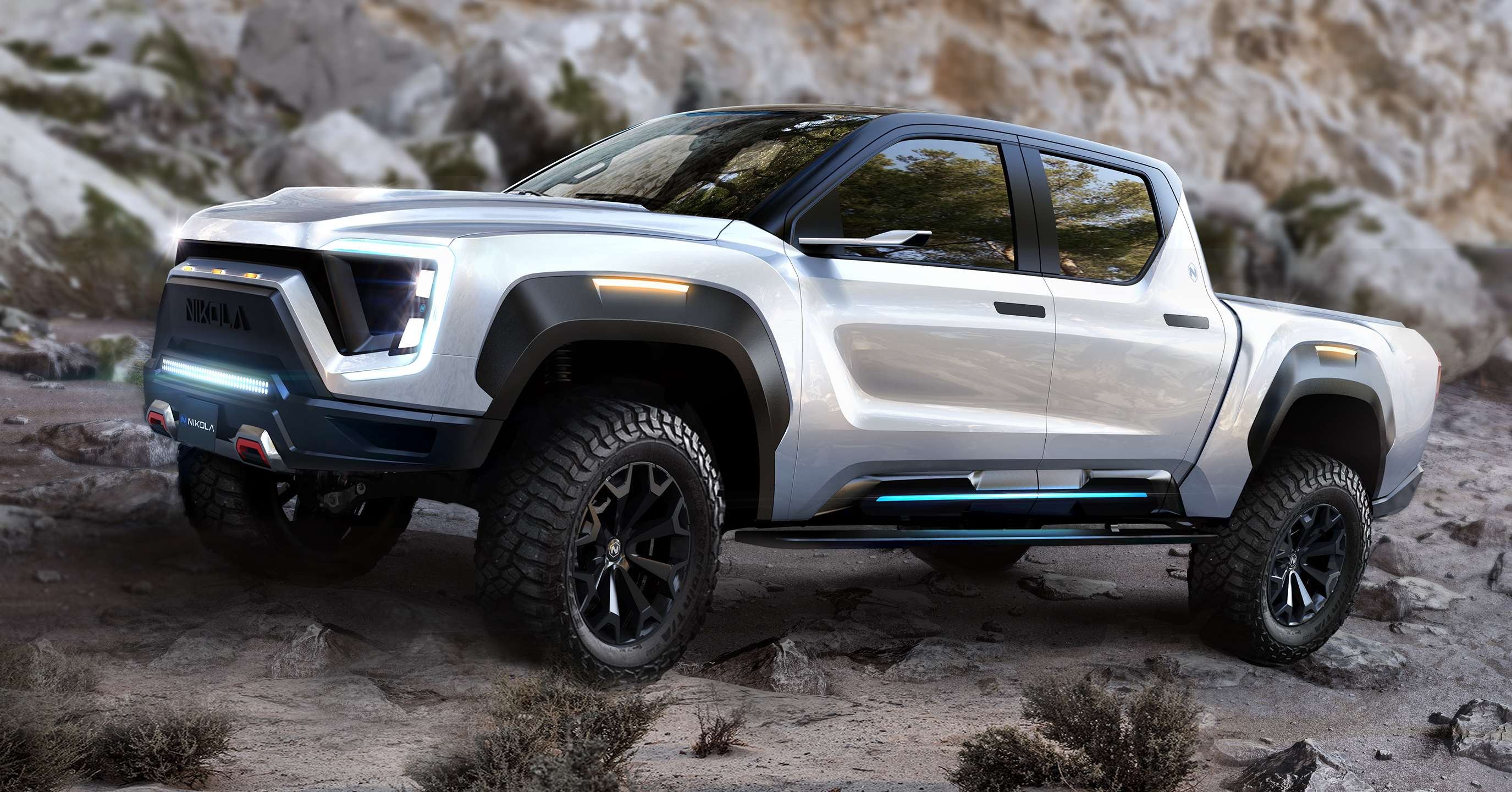 The Nikola Badger electric pick-up truck, displayed offroading over a rocky surface.