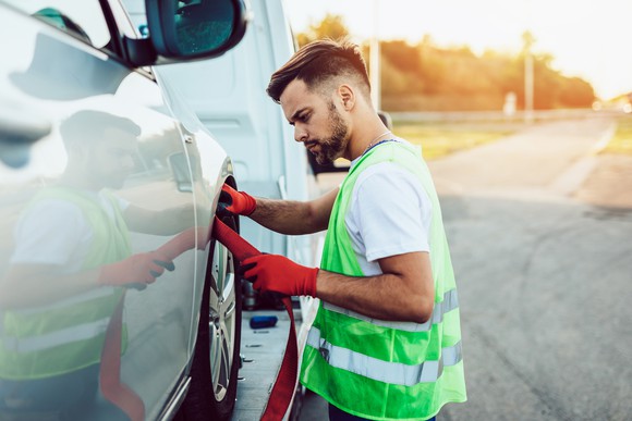 Man transporting a vehicle
